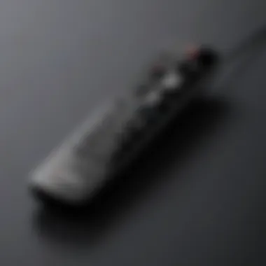 Close-up of Vizio TV remote control with highlighted buttons